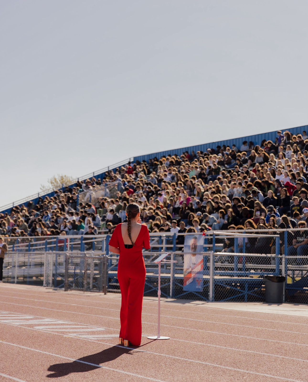 Students filming a Music and the Message assembly performance