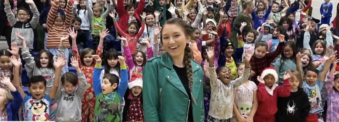 Rosevelt performing at a school assembly